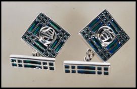 A pair of stamped 925 silver and enamel cufflinks