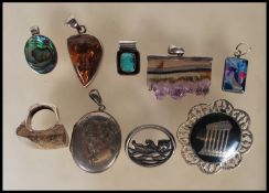 A  selection of silver jewellery to include a stam