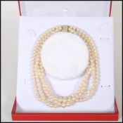 A 20th Century cultured pearl necklace having four