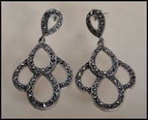 A pair of stamped 925 silver and marcasite drop ea