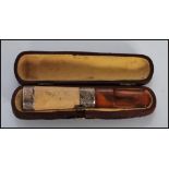 A early 20th Century silver and wooden cheroot hol