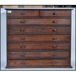 A early 20th Century stain pine specimen chest of