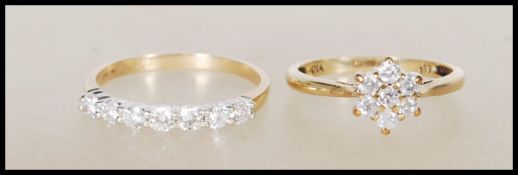 Two hallmarked 9ct yellow gold rings. One ring hav