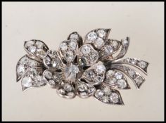 A mid 20th Century diamond flower brooch modelled