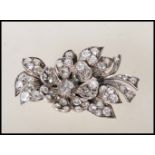 A mid 20th Century diamond flower brooch modelled