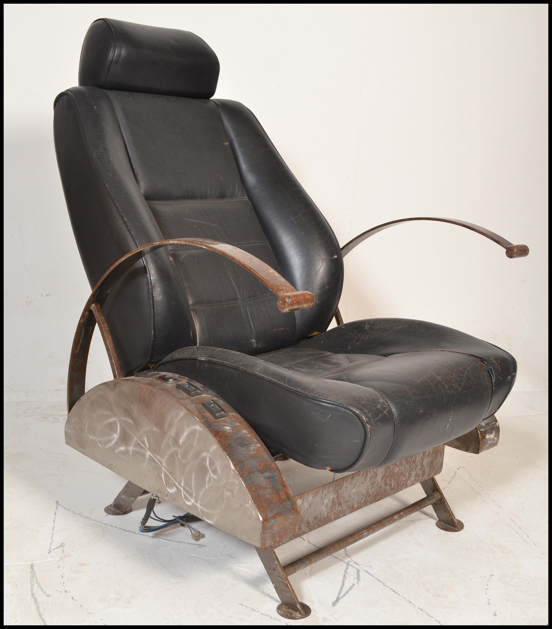 A retro 20th century car chair converted into a re