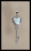 A Tiffany style key shape pendant having a heart s