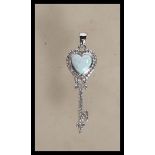 A Tiffany style key shape pendant having a heart s