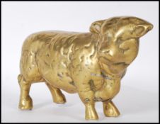A 20th Century heavy brass figure in the form of a