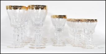 A large collection of glassware having scrolled de