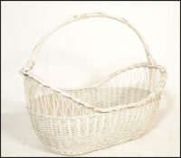 A vintage 20th Century wicker moses / laundry bask