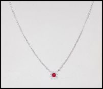 An 18ct white gold necklace pendant set with a a c