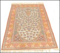 An early 20th Century persian style floor rug carp