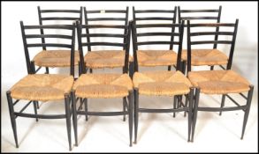 AFTER GIO PONTI SET OF EIGHT VINTAGE LADDER BACK DINING CHAIRS