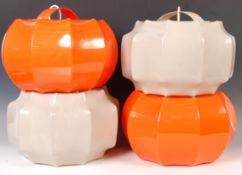 SET OF FOUR 1970'S ORANGE AND WHITE PLASTIC CEILING LAMP SHADES