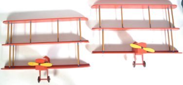 PAIR OF BOOKSHELVES MODELLED AS WWI GERMAN FOKKER DR-1 TRIPLANES