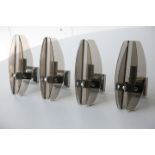 SET OF FOUR 1970'S SMOKED GLASS AND CHROME WALL LIGHTS