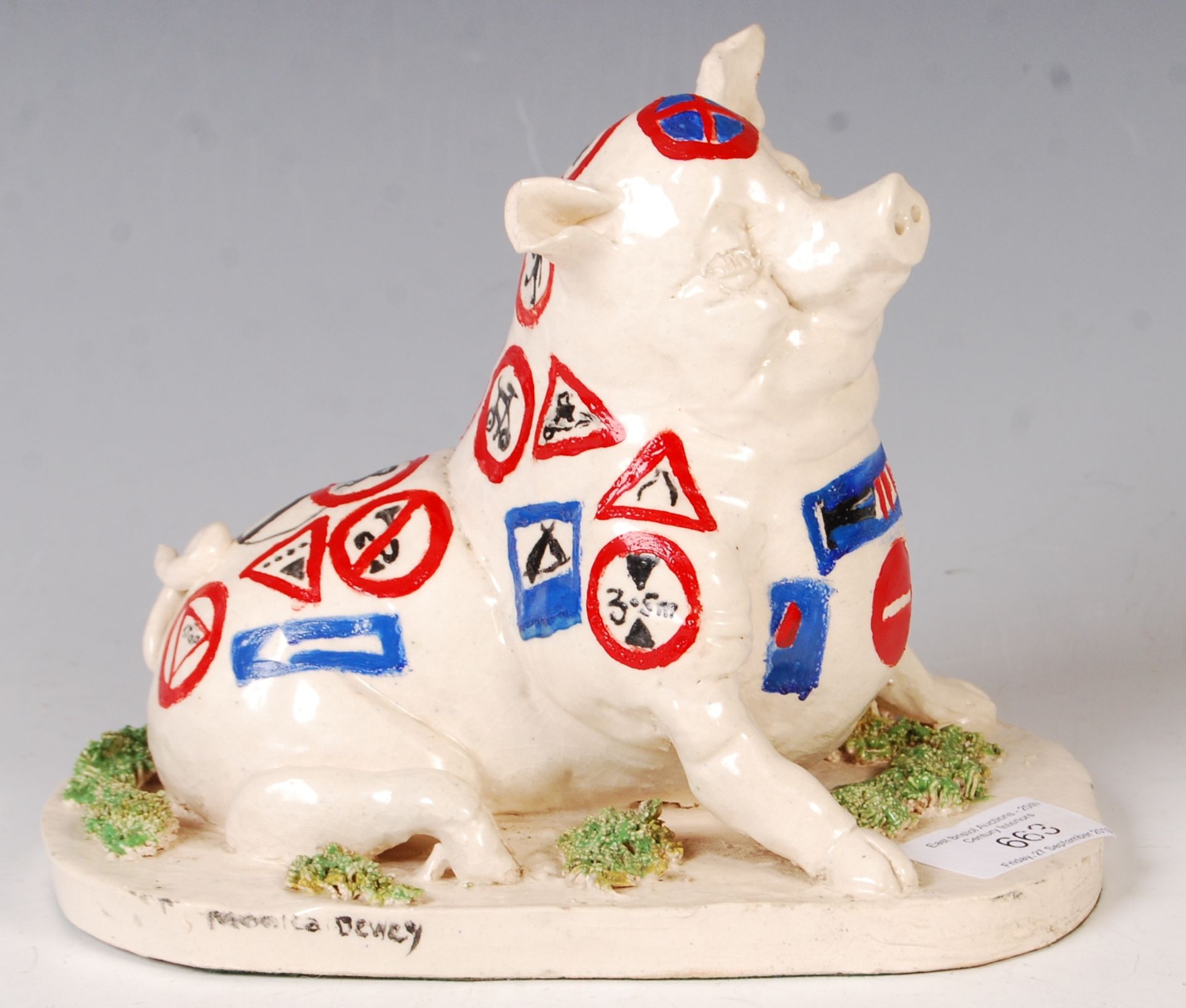 UNUSUAL STUDIO POTTERY CLAY PIG DECORATED WITH ROAD SIGNS