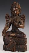 ANTIQUE CARVED FIGURINE OF A TIBETAN BUDDHA