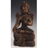 ANTIQUE CARVED FIGURINE OF A TIBETAN BUDDHA