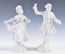 A PAIR OF 18TH CENTURY BISCUIT PORCELAIN FIGURES