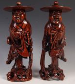 PAIR OF 19TH CENTURY CARVED MONK FIGURES WITH BONE TEETH AND GLASS EYES