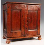 A 17TH CENTURY CARVED OAK SPICE CUPBOARD / CABINET