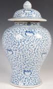 19TH CENTURY CHINESE BLUE AND WHITE TEMPLE JAR OF WAISTED FORM