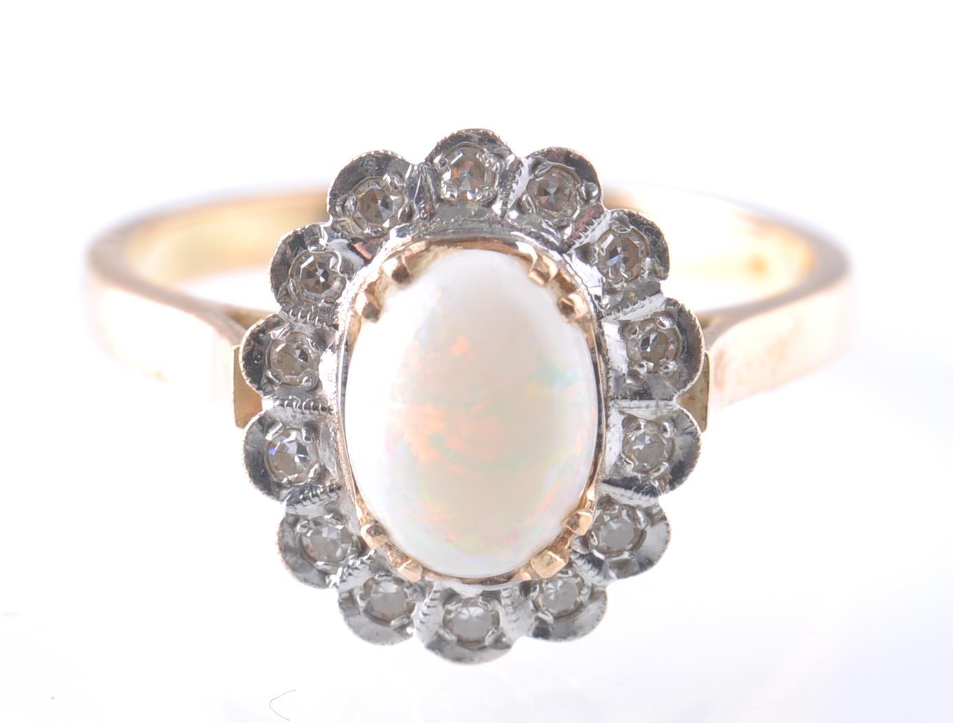 A 14CT GOLD OPAL AND DIAMOND RING