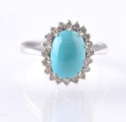 AN 18CT WHITE GOLD TURQUOISE AND DIAMOND OVAL CLUSTER RING