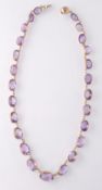 A 19TH CENTURY GOLD AND AMETHYST RIVIÉRE NECKLACE