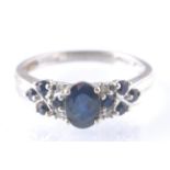 A HALLMARKED 9CT GOLD SAPPHIRE AND DIAMOND RING
