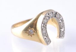 A HALLMARKED 18CT GOLD AND DIAMOND HORSESHOE RING