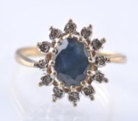 9CT GOLD SAPPHIRE AND DIAMOND CLUSTER RING APPROX 20PNTS