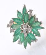 AN 14CT GOLD EMERALD AND DIAMOND CLUSTER DRESS RING.