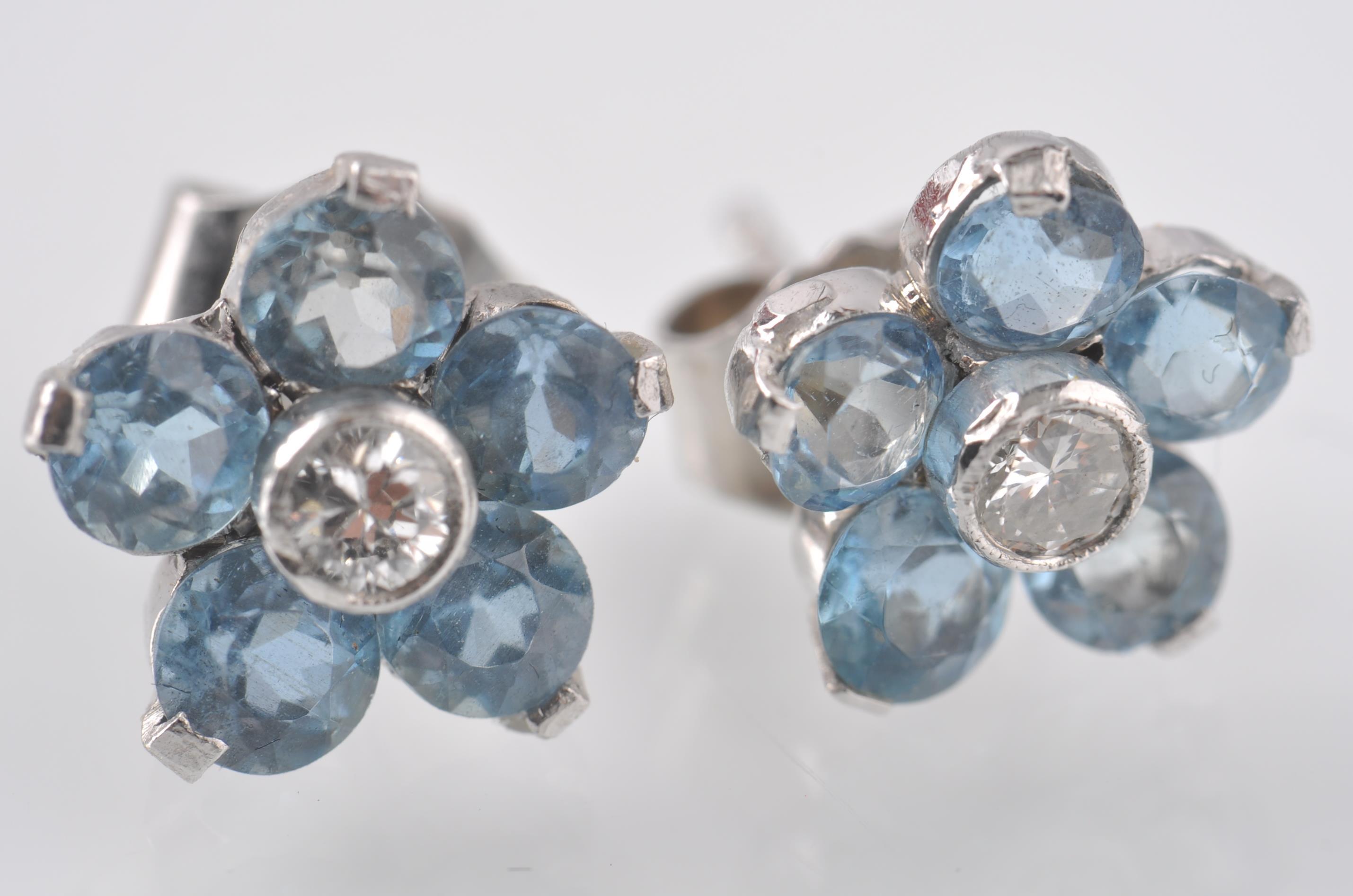 A PAIR OF 18CT WHITE GOLD, AQUAMARINE AND DIAMOND CLUSTER EARRINGS