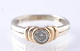 A CONTEMPORARY 9CT WHITE AND YELLOW GOLD DIAMOND SOLITAIRE RING