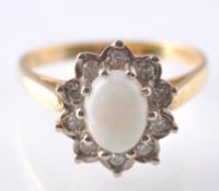 A 18CT GOLD OPAL & DIAMOND CLUSTER RING