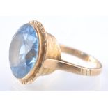 A 9CT GOLD PALE BLUE SPINEL ETRUSCAN STYLE RING