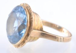 A 9CT GOLD PALE BLUE SPINEL ETRUSCAN STYLE RING
