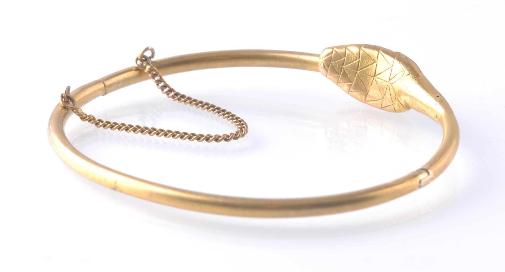 AN ANTIQUE OUROBOROS GOLD AND RUBY SNAKE BANGLE - Image 3 of 4