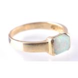 A 14CT GOLD AND SYNTHETIC OPAL RING
