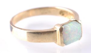A 14CT GOLD AND SYNTHETIC OPAL RING