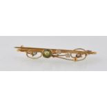ART NOUVEAU 9CT GOLD PERIDOT AND SEED PEARL BROOCH