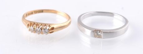 TWO 18CT GOLD AND DIAMOND RINGS TO INCLUDE SOLITAIRE & 3 STONE