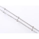 AN 18CT WHITE GOLD AND DIAMOND NECKLACE - 16 COLLET SET DIAMONDS