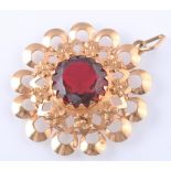 AN 18CT GOLD AND RED GEM SET PENDANT