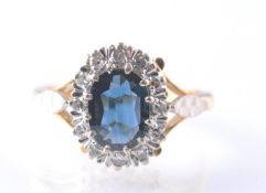 A HALLMARKED 18CT GOLD SAPPHIRE AND DIAMOND RING