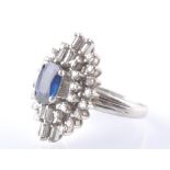 AN ART DECO STYLE 18CT GOLD SAPPHIRE & DIAMOND CLUSTER RING
