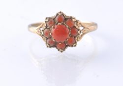 A HALLMARKED 9CT GOLD CORAL CLUSTER RING